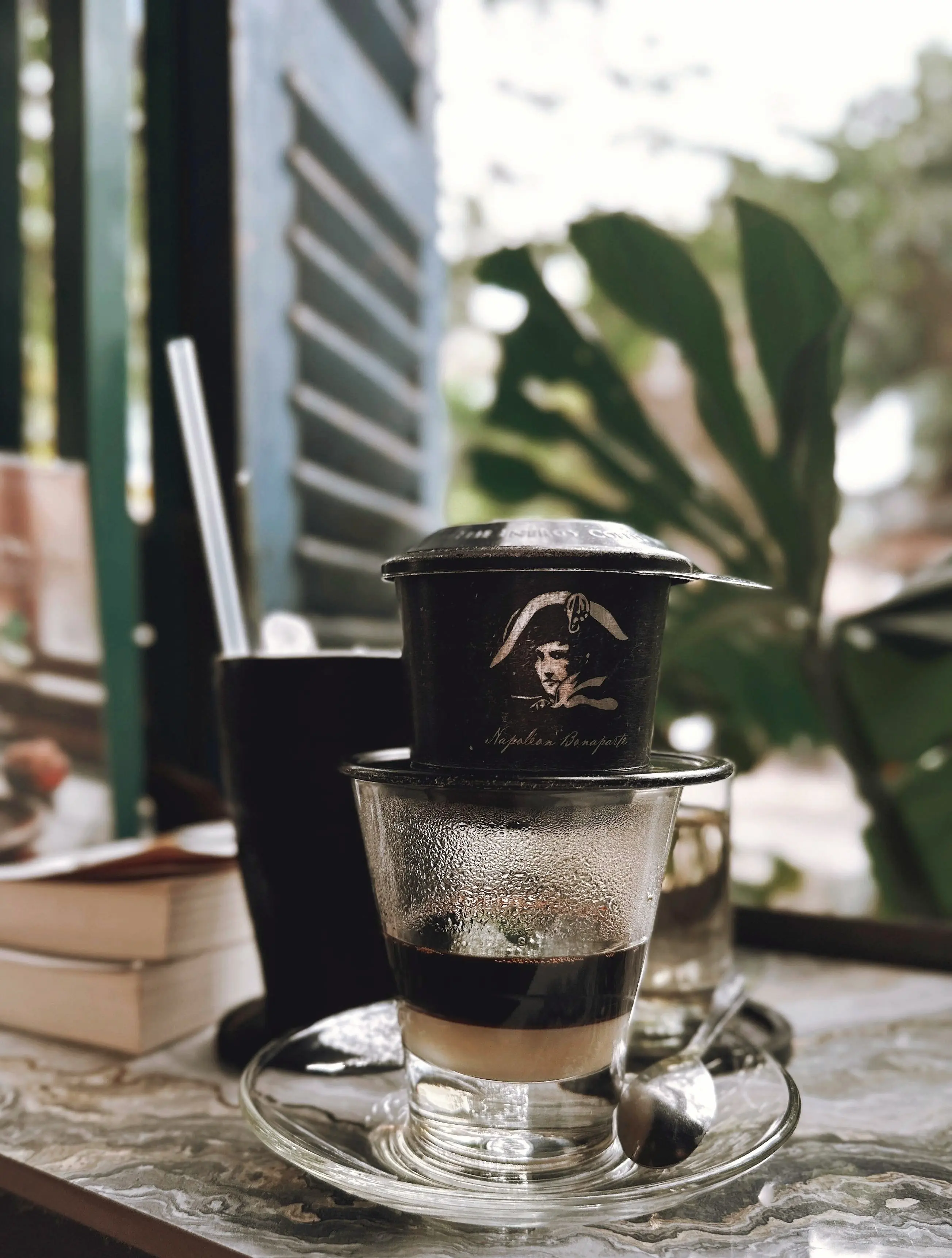 Vietnamese phin coffee in a tropical cafe
